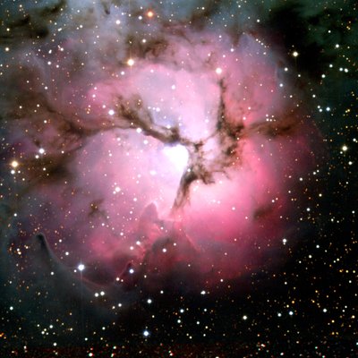 Spitzer Space Telescope composite comparison of visible-light and infrared views of the Trifid Nebula by National Aeronautics and Space Administration National Aeronautics and Space Administration